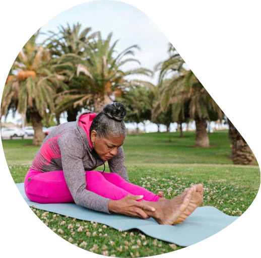 Person practicing mindful yoga to prevent injuries